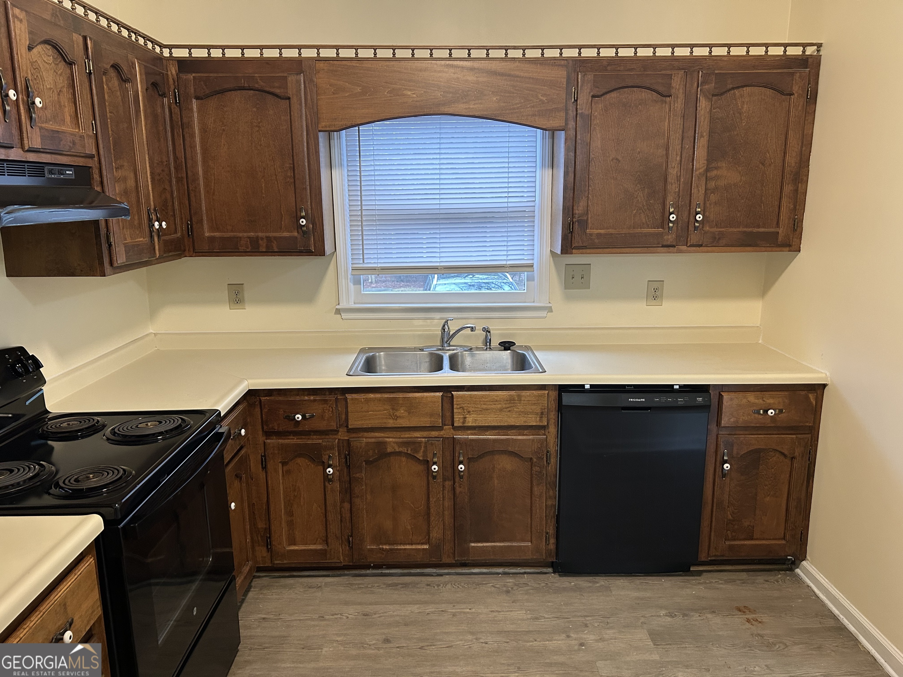 250 Cleveland Road, Unit 219 Bogart, GA 30622 - Photo 9 of 20 a kitchen with stainless steel appliances granite countertop a sink dishwasher a stove and a microwave oven with cabinets