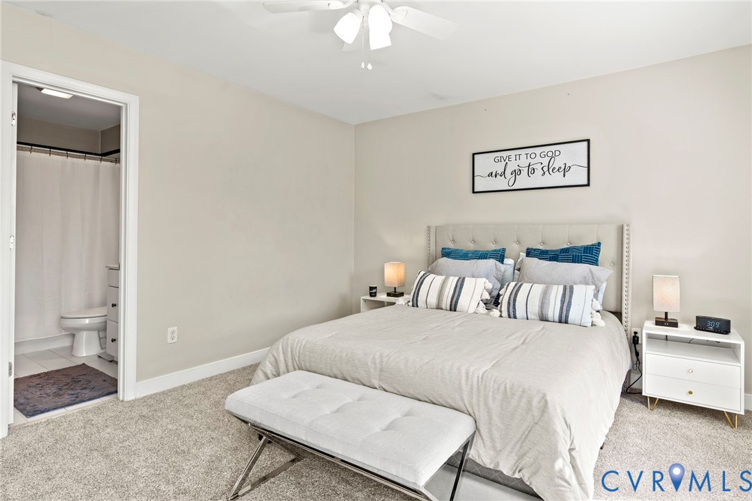 605 Spring Street, Unit B Richmond, VA 23220 - Photo 23 of 42 a bedroom with a bed and a chandelier