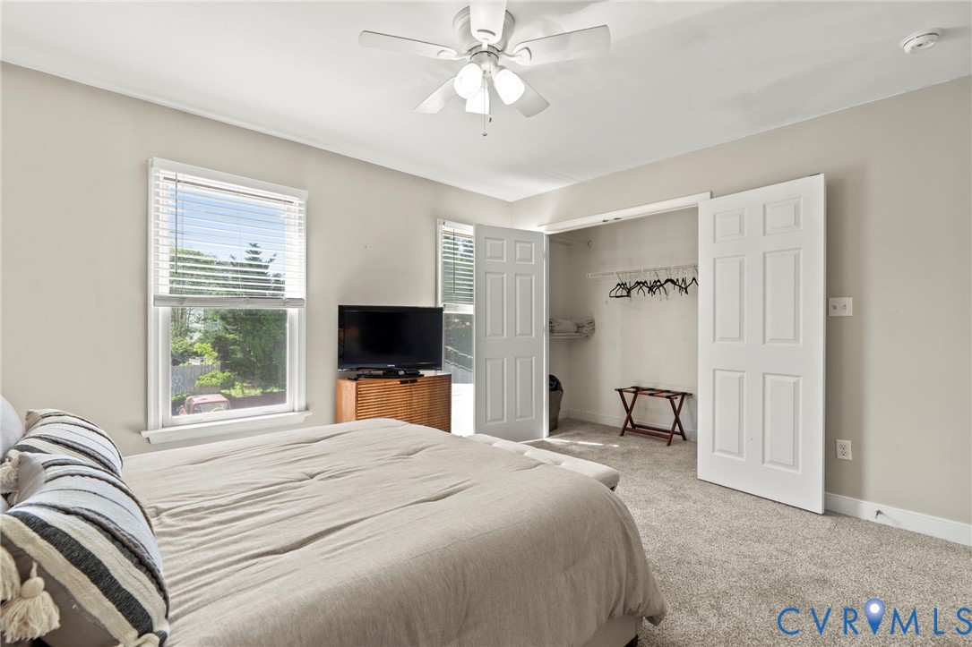 605 Spring Street, Unit B Richmond, VA 23220 - Photo 24 of 42 a bedroom with a bed and a flat screen tv