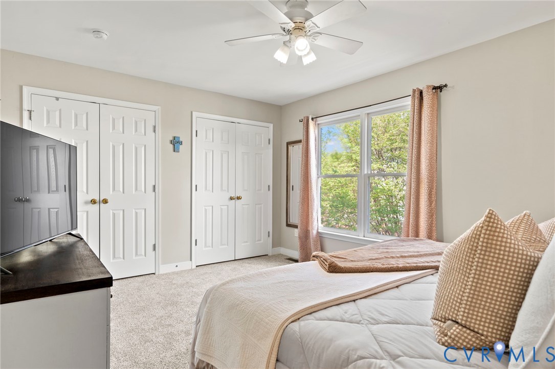 605 Spring Street, Unit B Richmond, VA 23220 - Photo 28 of 42 a bedroom with a bed and a chair