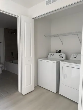 a utility room with dryer and washer