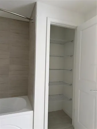 a bathroom with a glass shower door