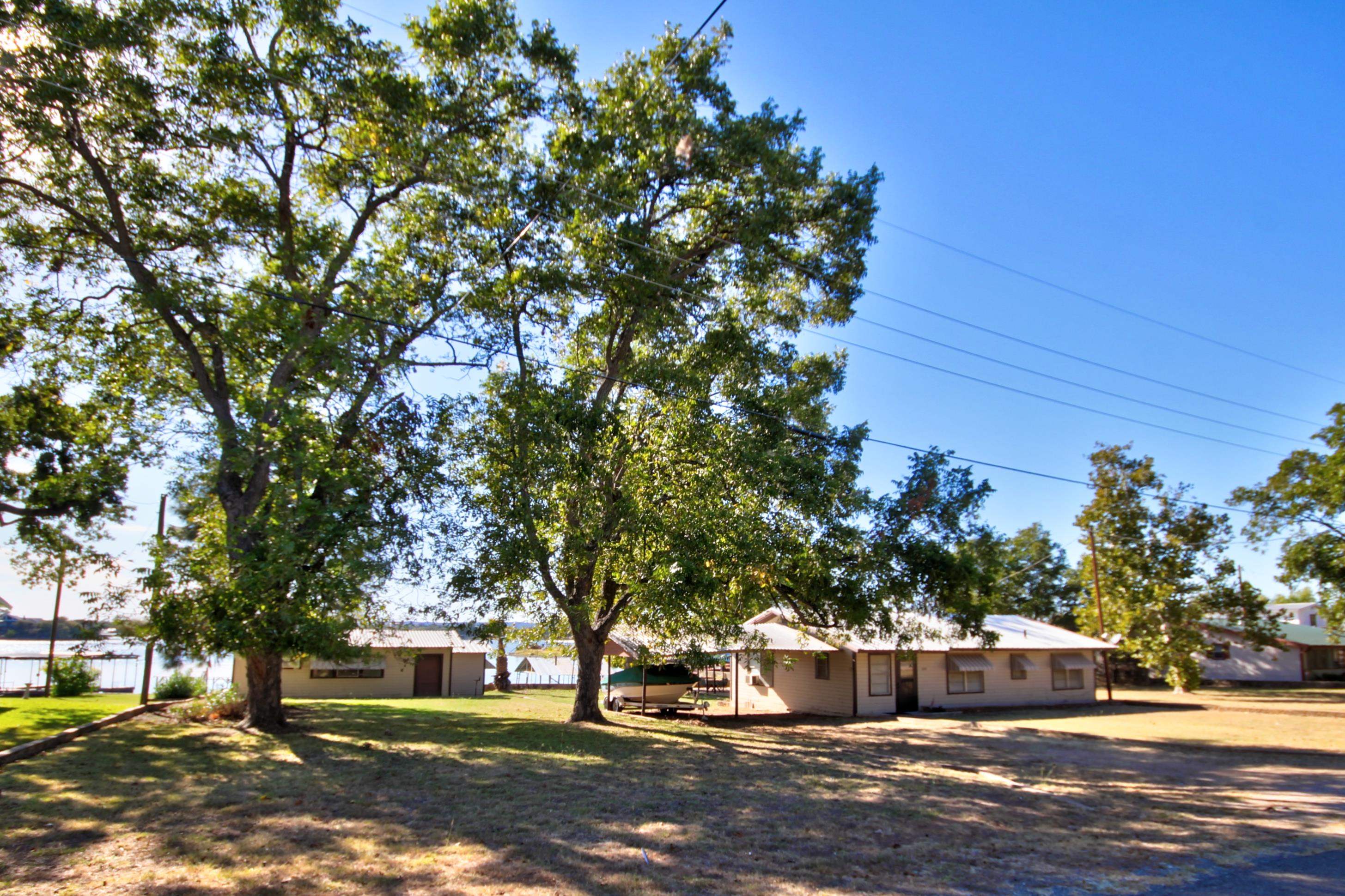 1021 Lakeshore Loop Tow, TX 78672 - Photo 1 of 1 a view of street with trees