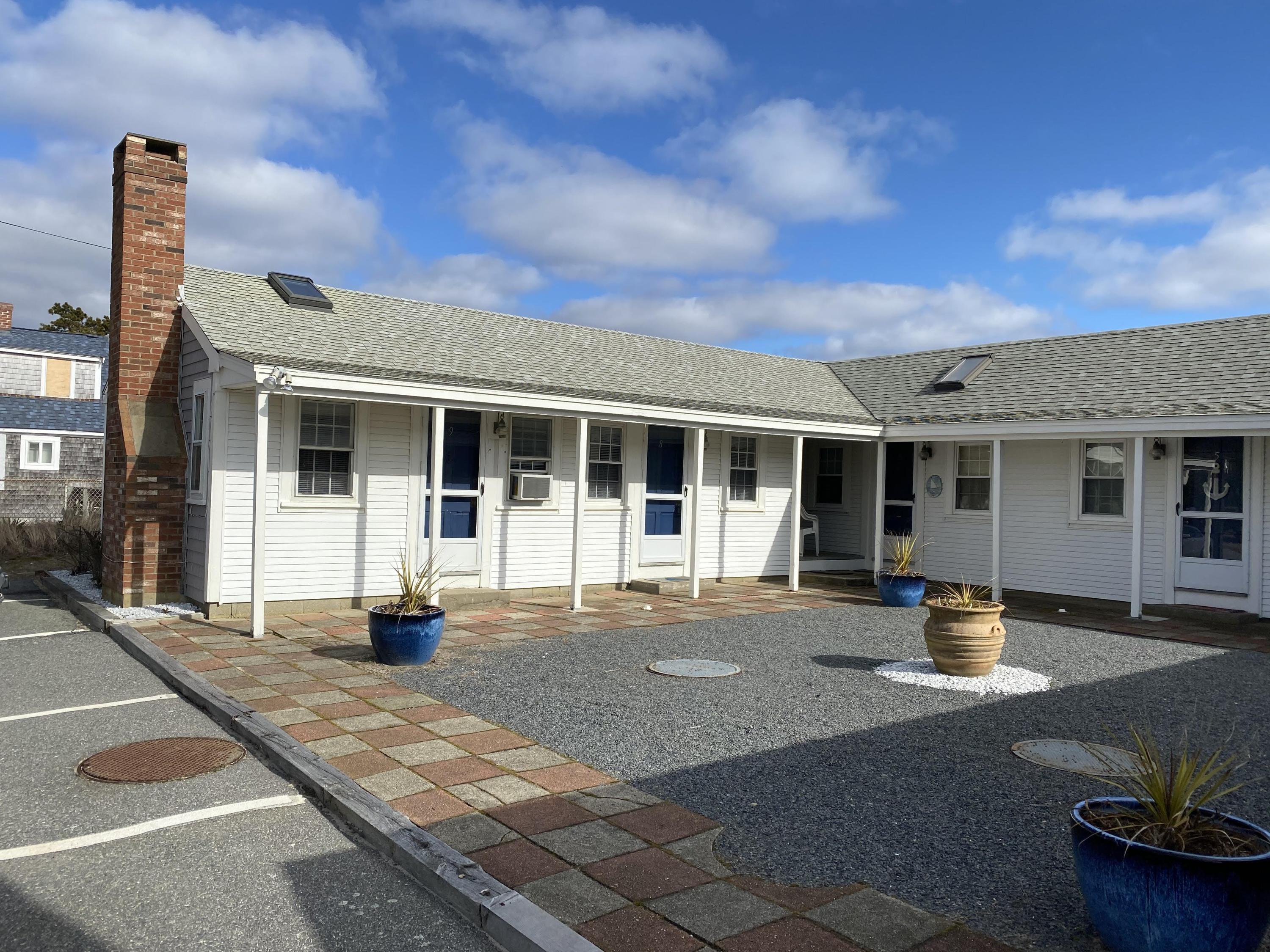 110 Glendon Road, Unit 8 Dennis Port, MA 02639 - Photo 1 of 21 a front view of a building with street