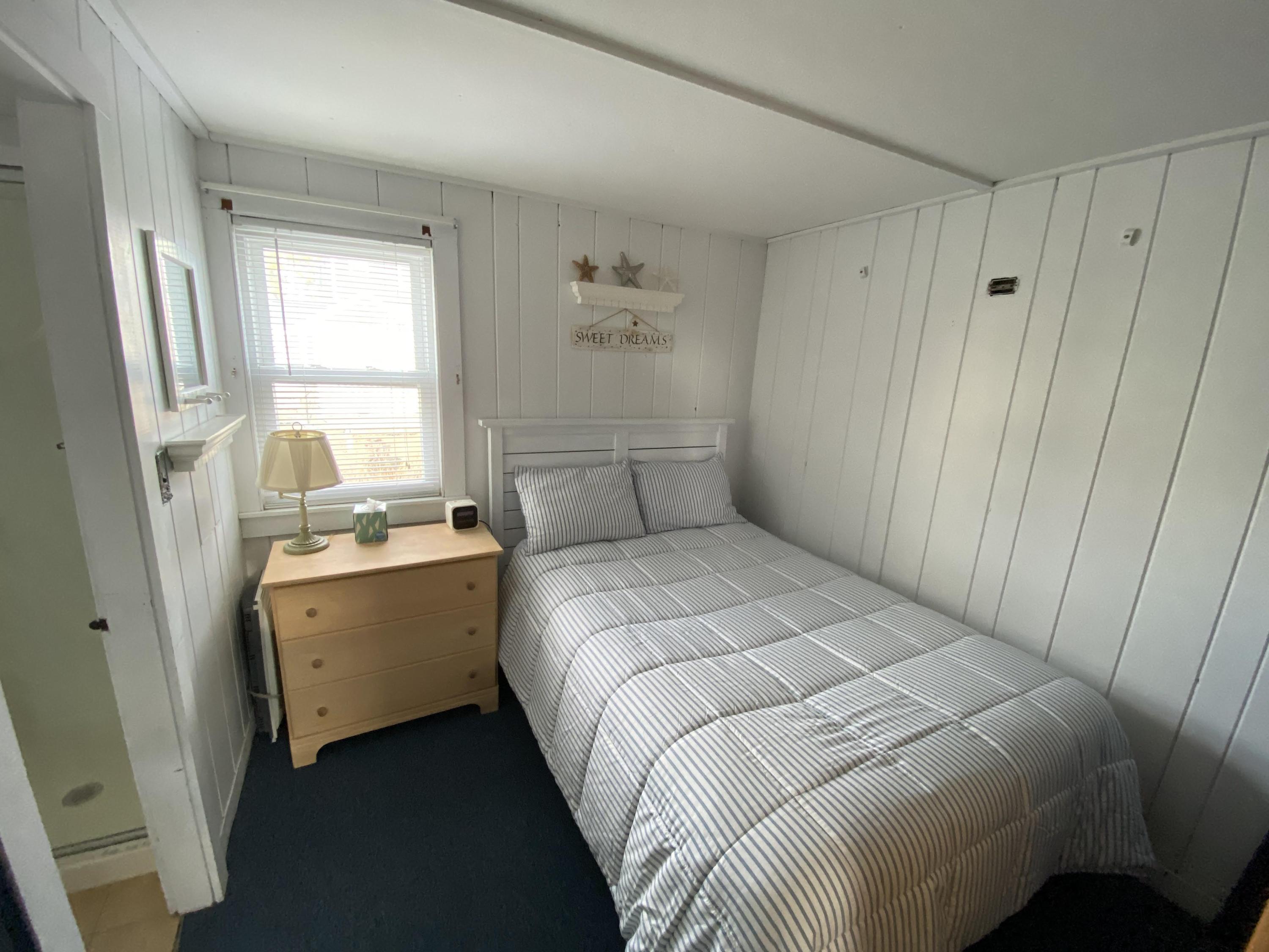 110 Glendon Road, Unit 8 Dennis Port, MA 02639 - Photo 13 of 21 a bedroom with a bed and a window