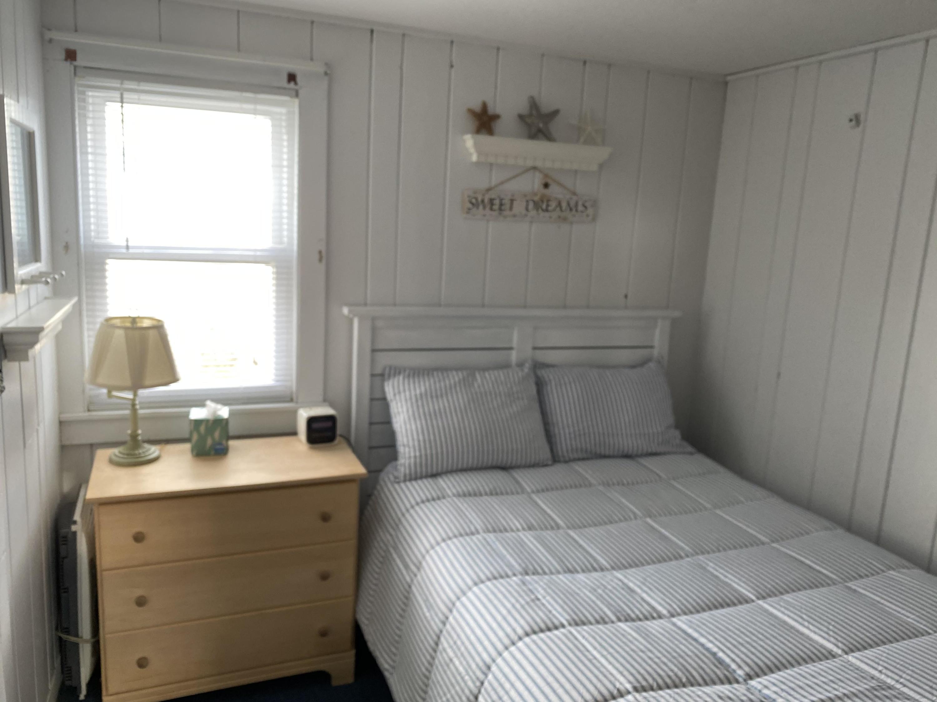 110 Glendon Road, Unit 8 Dennis Port, MA 02639 - Photo 14 of 21 a bedroom with a bed and a window