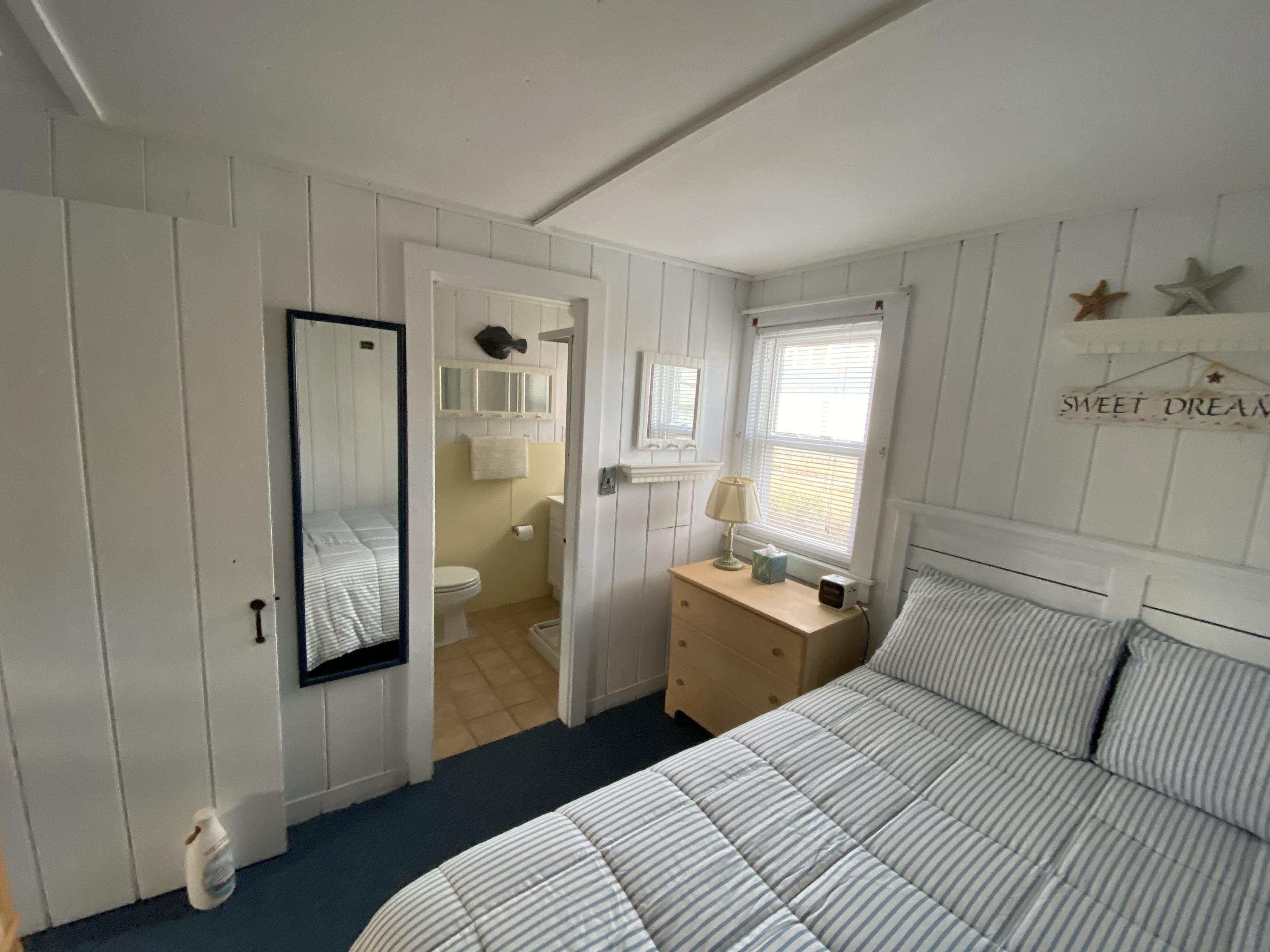 110 Glendon Road, Unit 8 Dennis Port, MA 02639 - Photo 15 of 21 a bedroom with a bed and a walk in closet