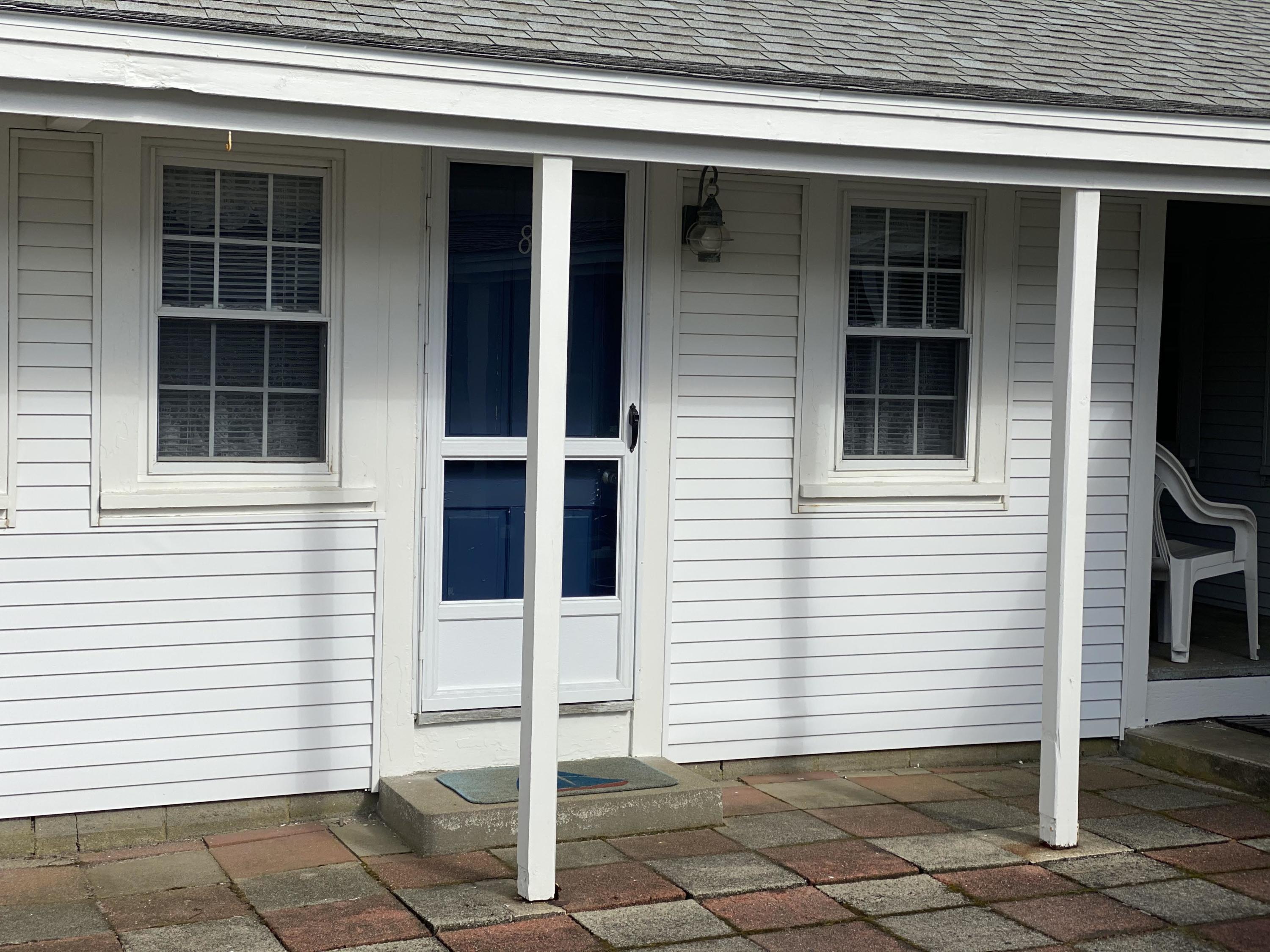 110 Glendon Road, Unit 8 Dennis Port, MA 02639 - Photo 4 of 21 a view of a house with white door and a window