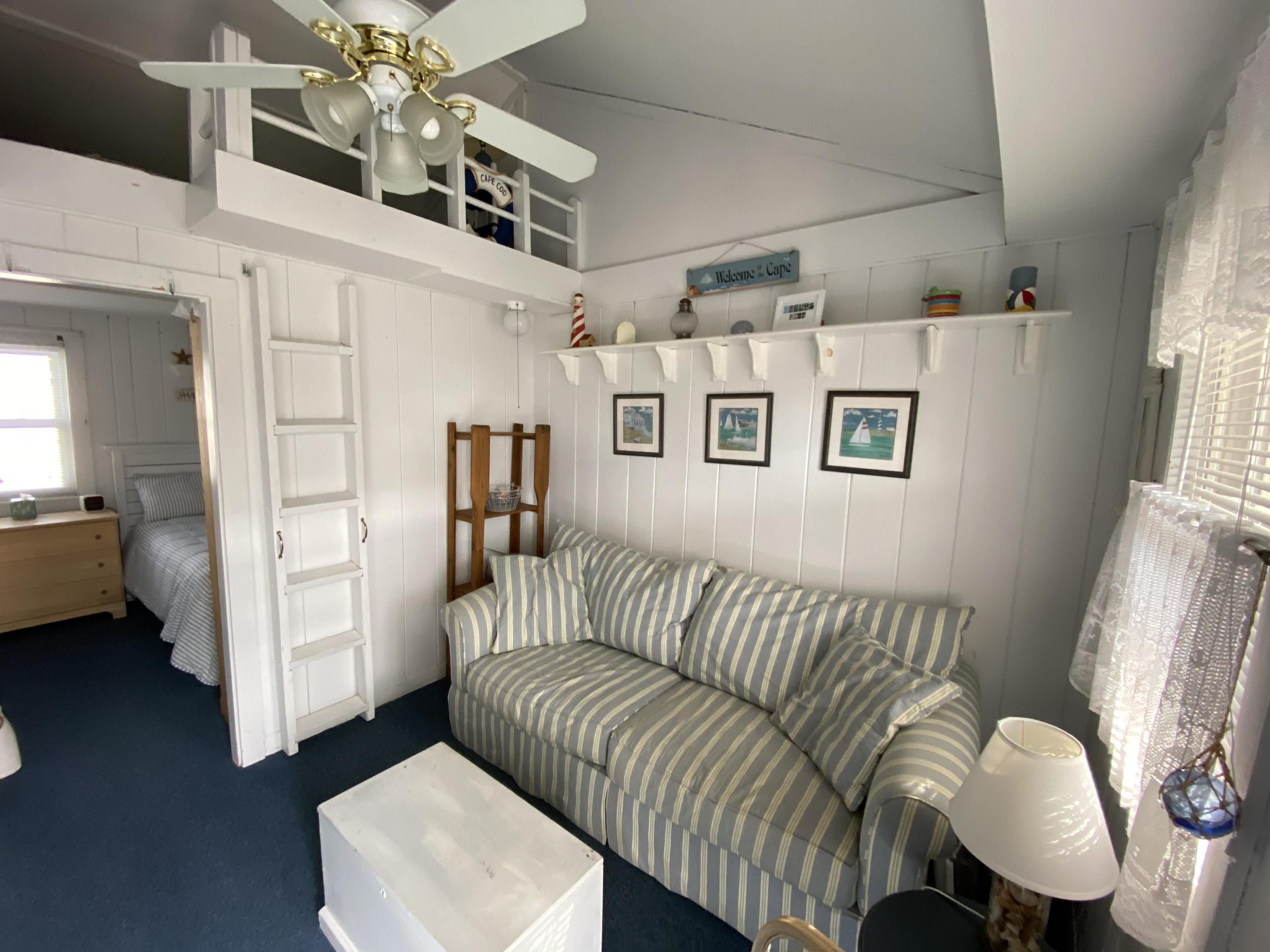 110 Glendon Road, Unit 8 Dennis Port, MA 02639 - Photo 6 of 21 a living room with furniture and a window