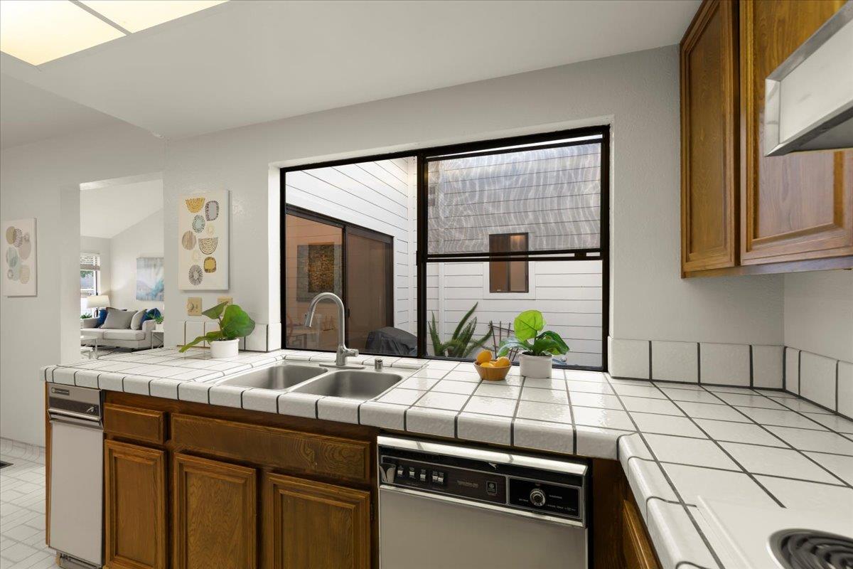 100 Strathmore Place Los Gatos, CA 95032 - Photo 14 of 39 a kitchen with a sink and a window
