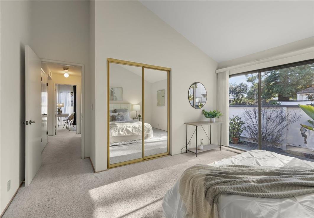 100 Strathmore Place Los Gatos, CA 95032 - Photo 20 of 39 a bedroom with a bed a chandelier and large window