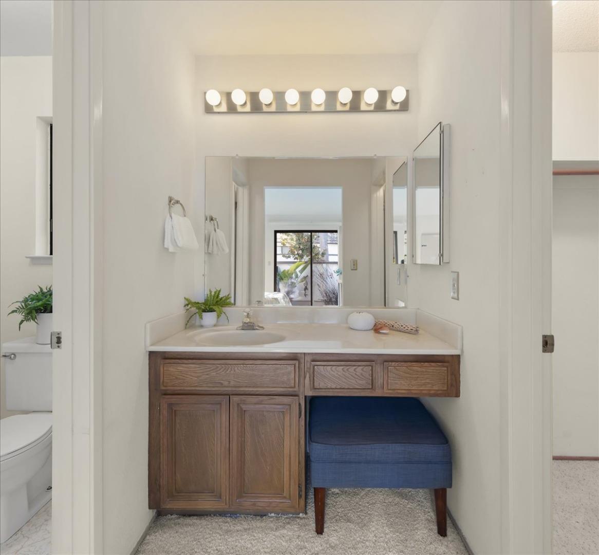100 Strathmore Place Los Gatos, CA 95032 - Photo 22 of 39 a en suite bathroom with a sink and a mirror
