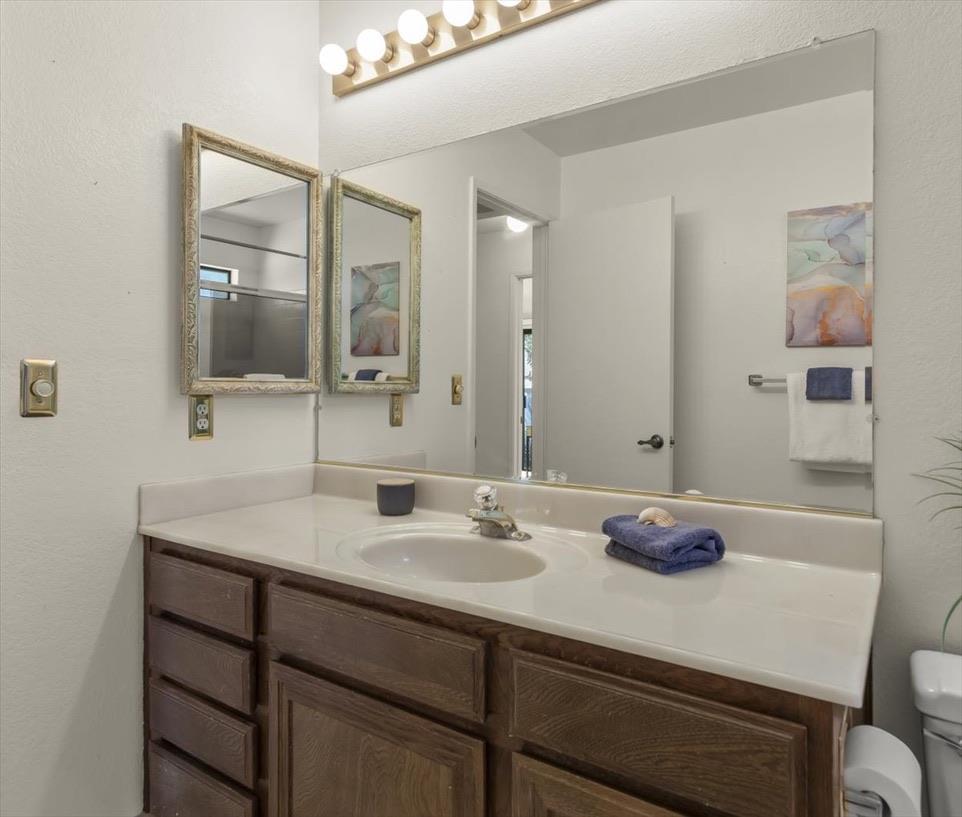100 Strathmore Place Los Gatos, CA 95032 - Photo 28 of 39 a bathroom with a sink and a mirror