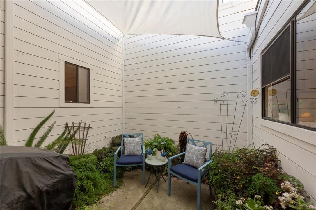 100 Strathmore Place Los Gatos, CA 95032 - Photo 29 of 39 a view of a chair and table in backyard of the house