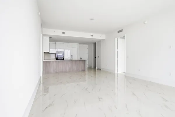 a bathroom with a shower a toilet and a sink