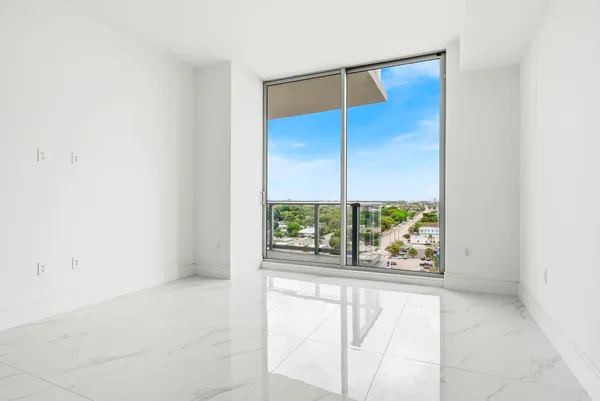 a view of a patio with couches table and chairs and potted plants