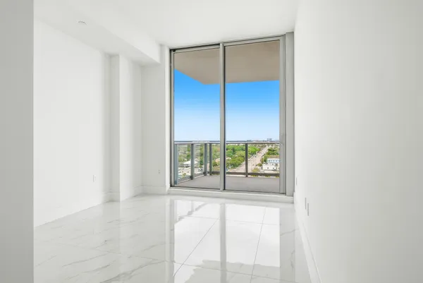 a view of a building with a sitting area