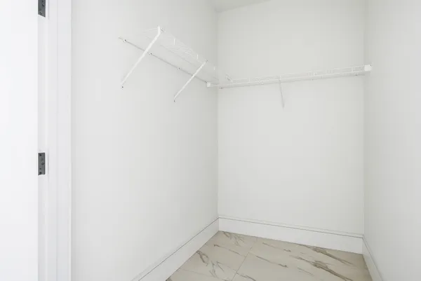 a living room with lots of furniture and a large window