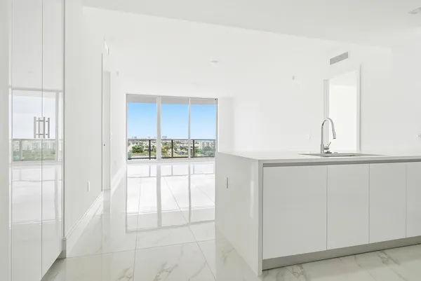 a kitchen with stainless steel appliances a refrigerator and cabinets