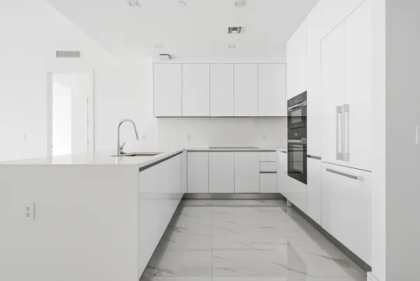 a view of an empty room with a large window