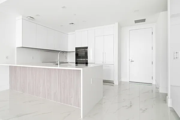 a view of an empty room and a window