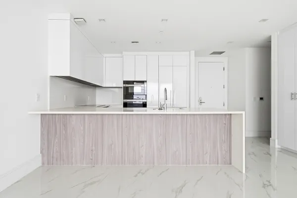 a bathroom with a bathtub sink and mirror