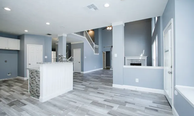 a view of kitchen and kitchen with furniture and refrigerator