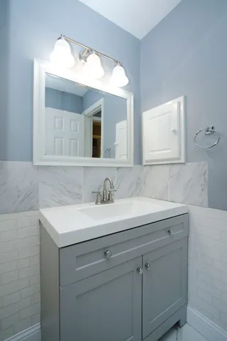a bathroom with a sink and a mirror