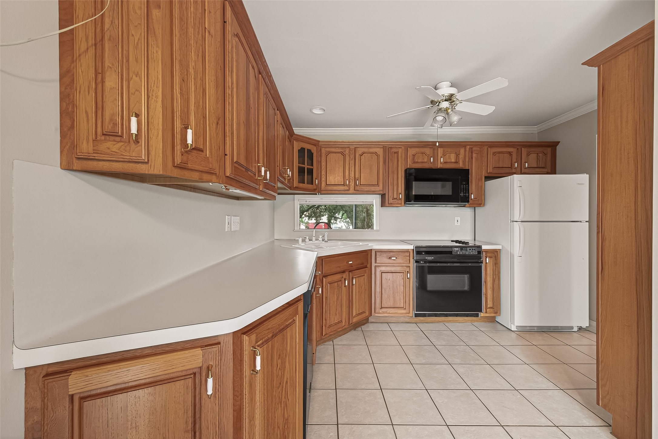 8211 Katy Freeway, Unit 19 Houston, TX 77024 - Photo 14 of 39 a kitchen with kitchen island granite countertop cabinets and stainless steel appliances