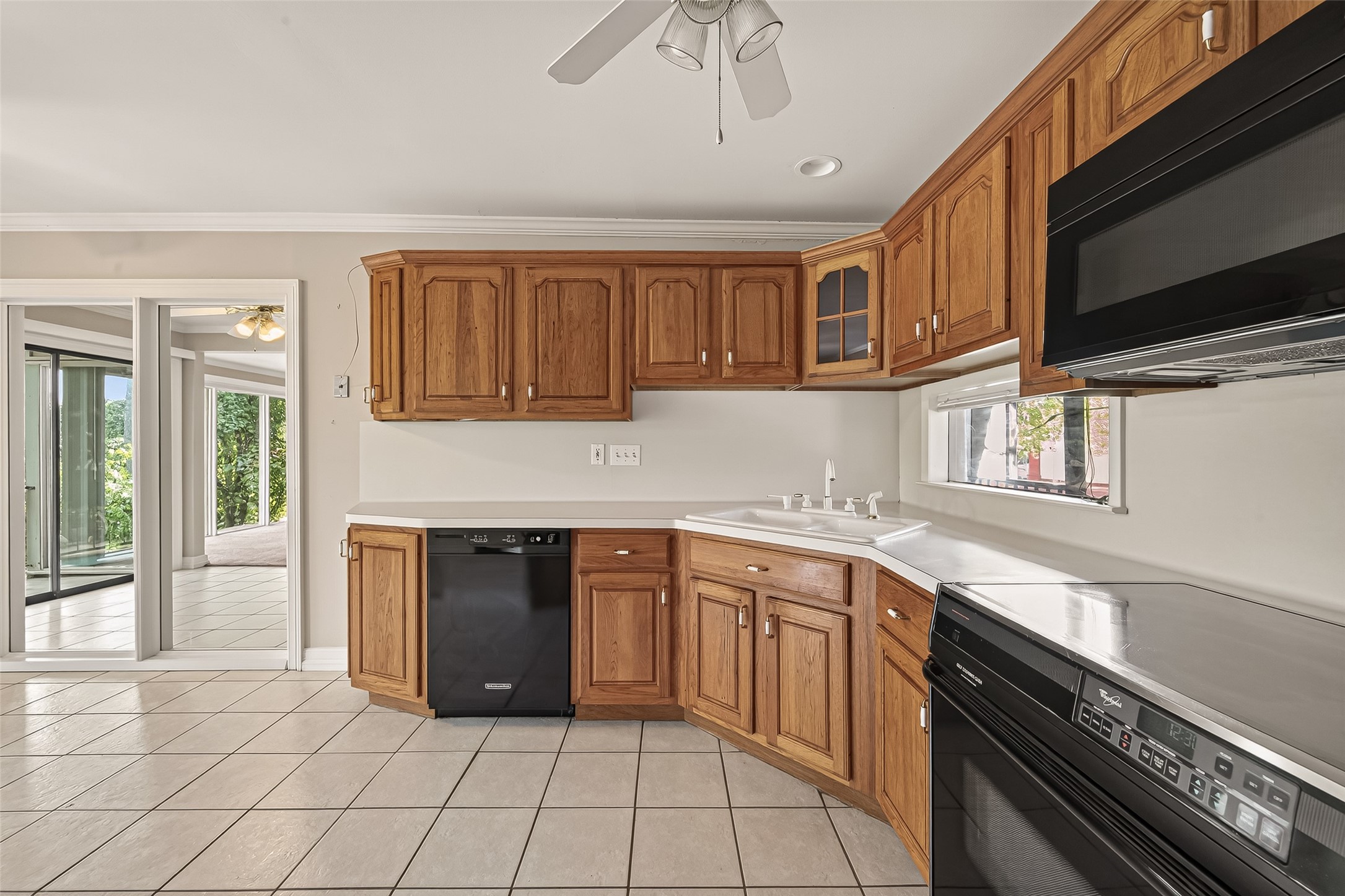 8211 Katy Freeway, Unit 19 Houston, TX 77024 - Photo 15 of 39 a kitchen with stainless steel appliances granite countertop a stove sink and cabinets