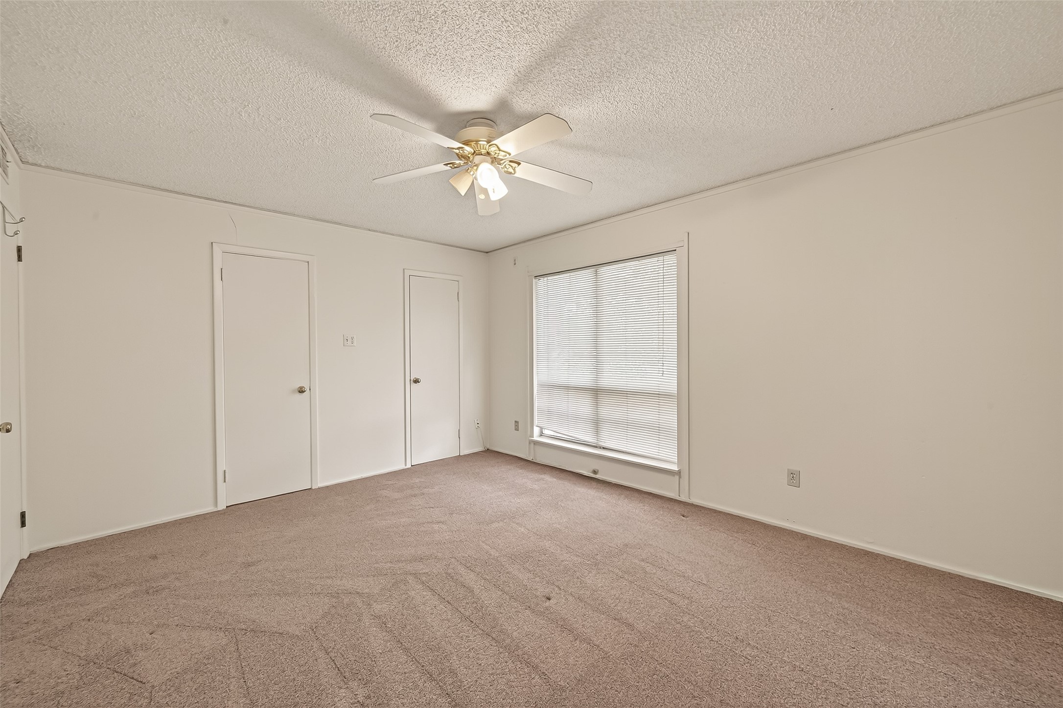 8211 Katy Freeway, Unit 19 Houston, TX 77024 - Photo 19 of 39 a view of an empty room with a window
