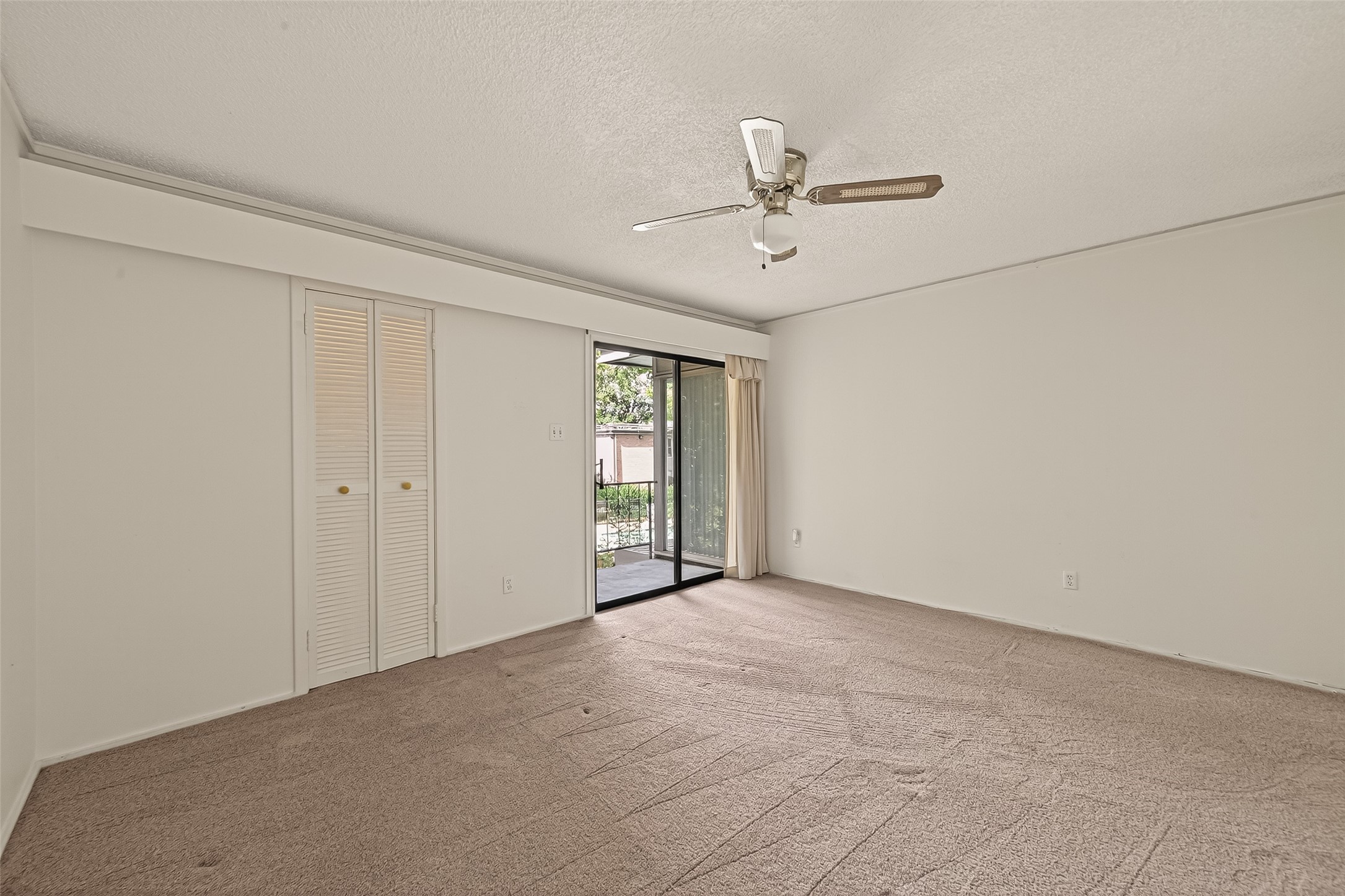 8211 Katy Freeway, Unit 19 Houston, TX 77024 - Photo 22 of 39 a view of an empty room with a window