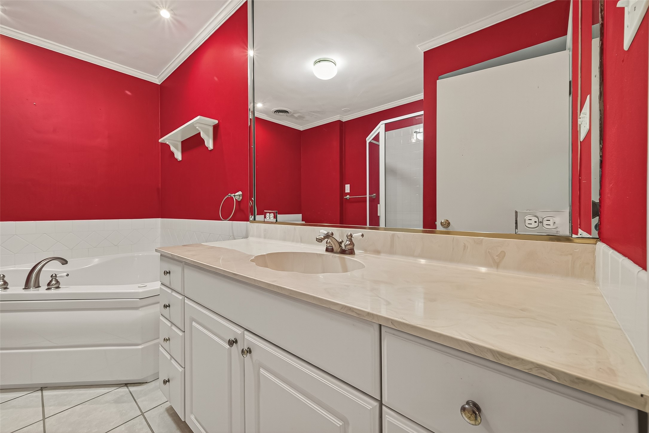 8211 Katy Freeway, Unit 19 Houston, TX 77024 - Photo 23 of 39 a bathroom with a sink and a mirror