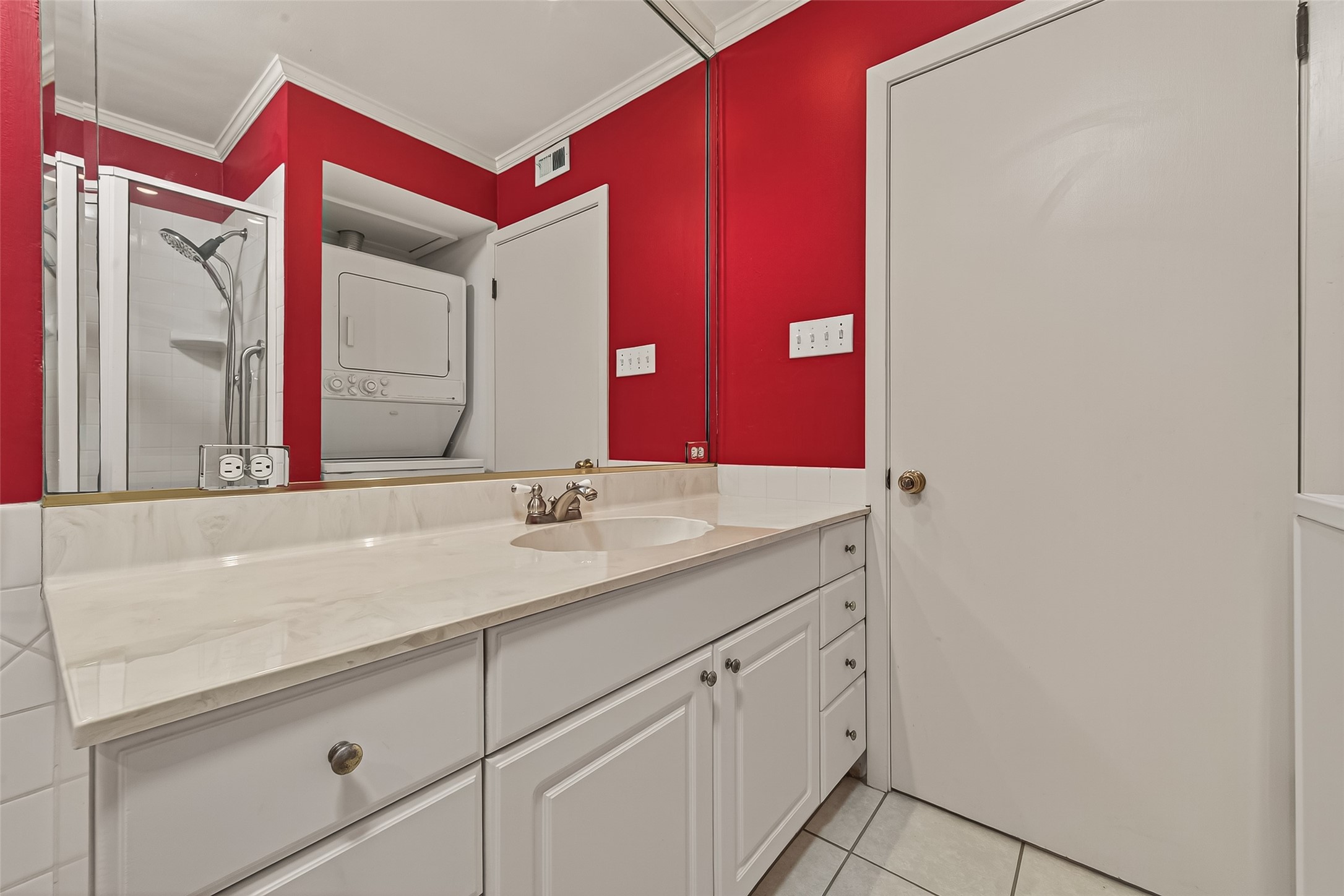 8211 Katy Freeway, Unit 19 Houston, TX 77024 - Photo 24 of 39 a bathroom with a sink and a mirror