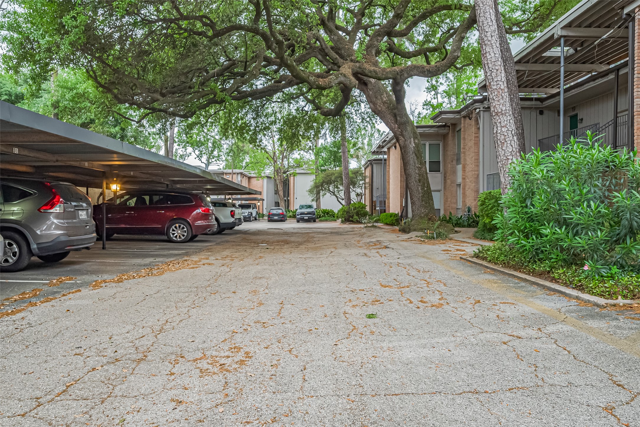 8211 Katy Freeway, Unit 19 Houston, TX 77024 - Photo 36 of 39 a view of street with parked cars
