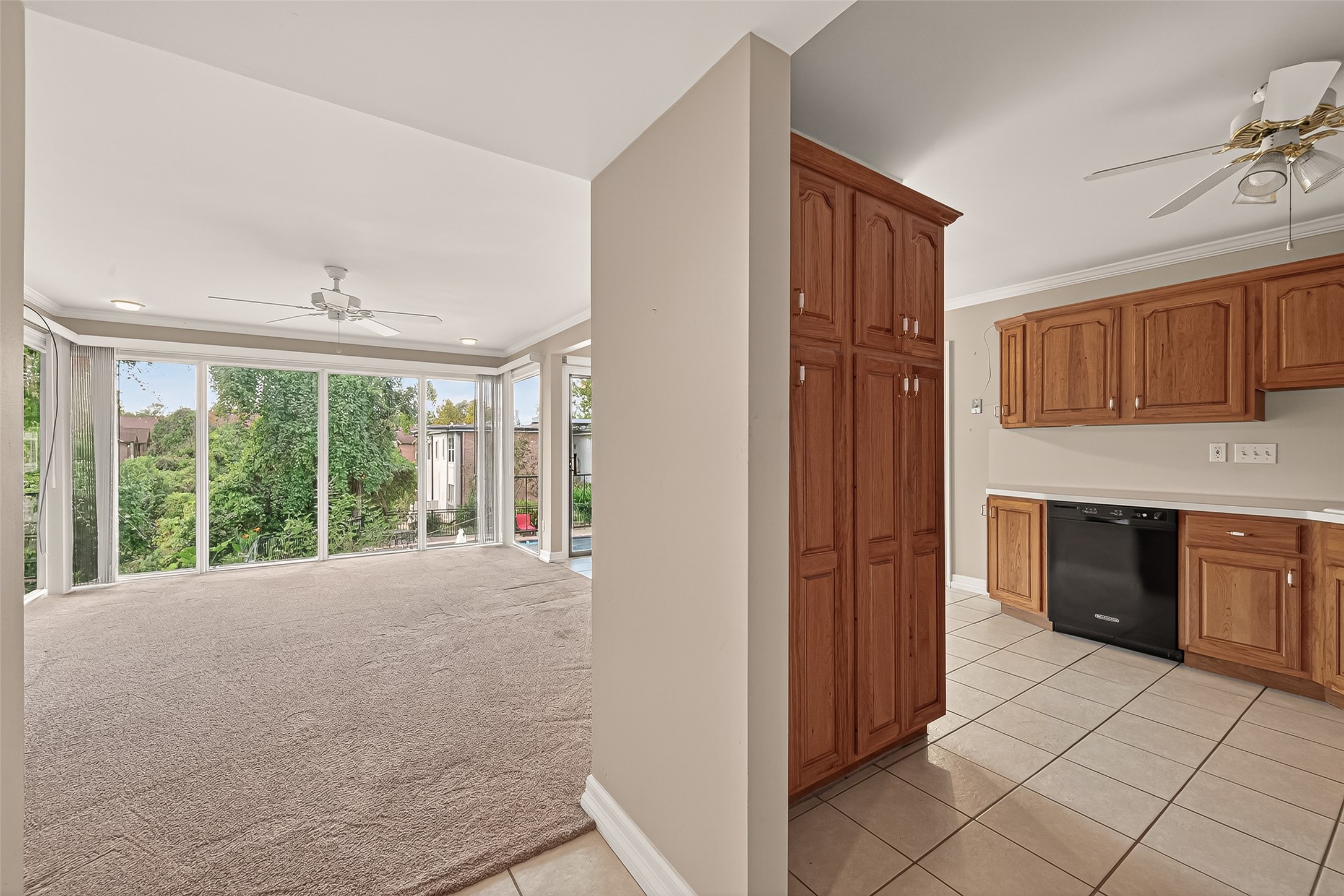 8211 Katy Freeway, Unit 19 Houston, TX 77024 - Photo 4 of 39 a view of an empty room with a kitchen and a window