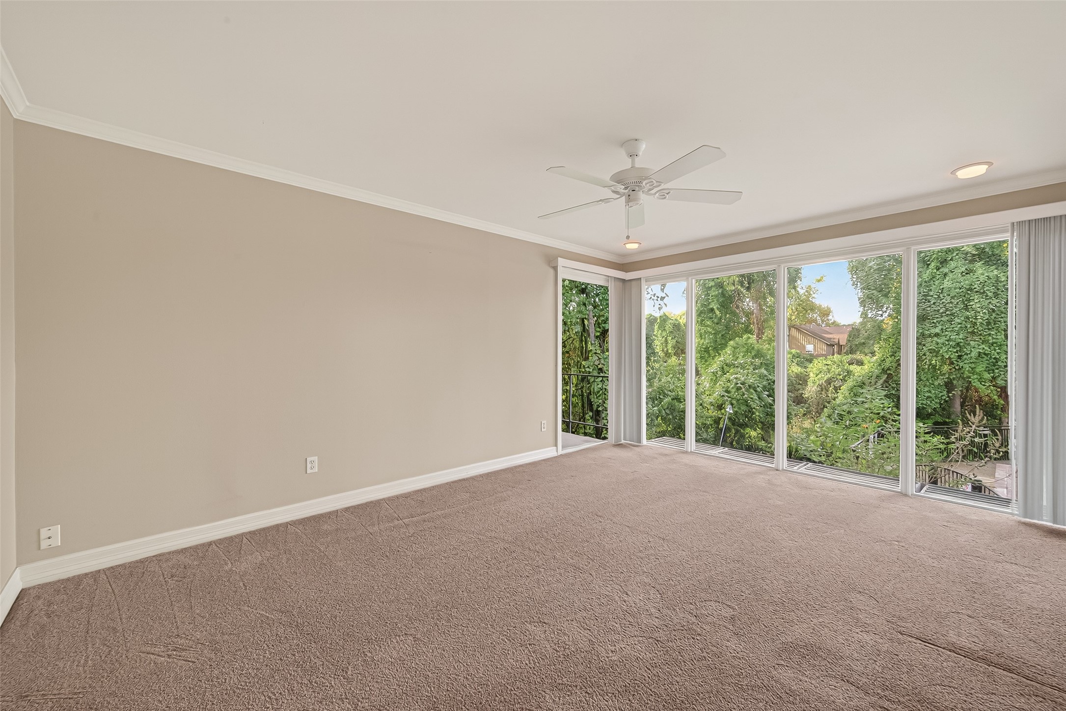 8211 Katy Freeway, Unit 19 Houston, TX 77024 - Photo 5 of 39 a view of a big room with windows and chandelier fan