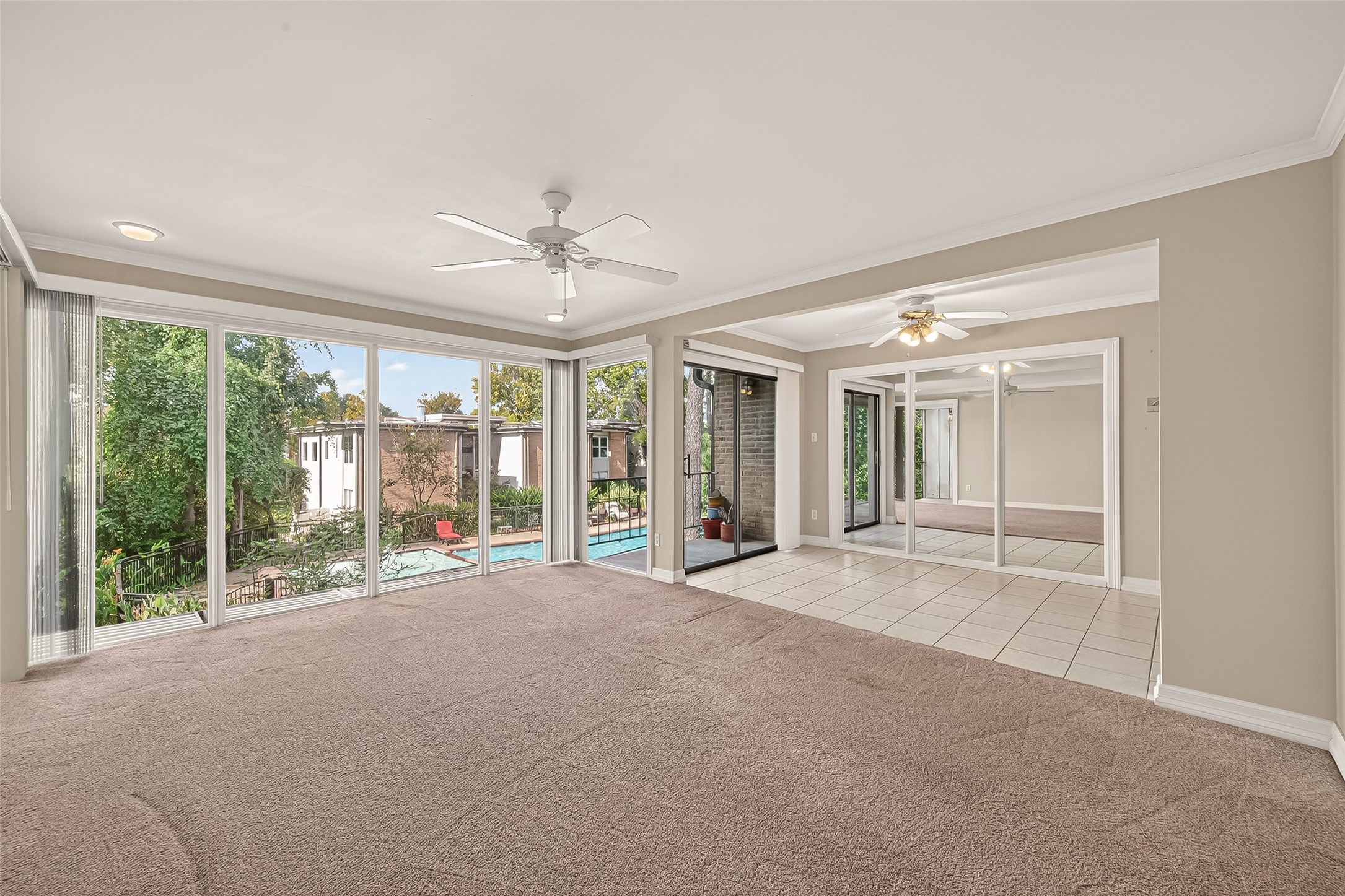 8211 Katy Freeway, Unit 19 Houston, TX 77024 - Photo 6 of 39 a view of an empty room with a fireplace and a large window