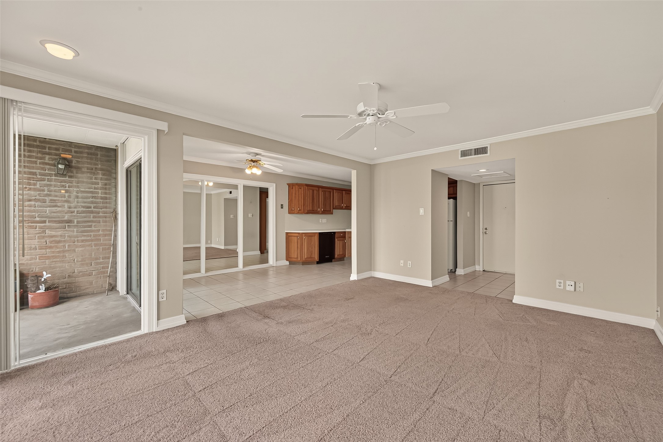 8211 Katy Freeway, Unit 19 Houston, TX 77024 - Photo 7 of 39 a view of empty room with a fireplace and entryway