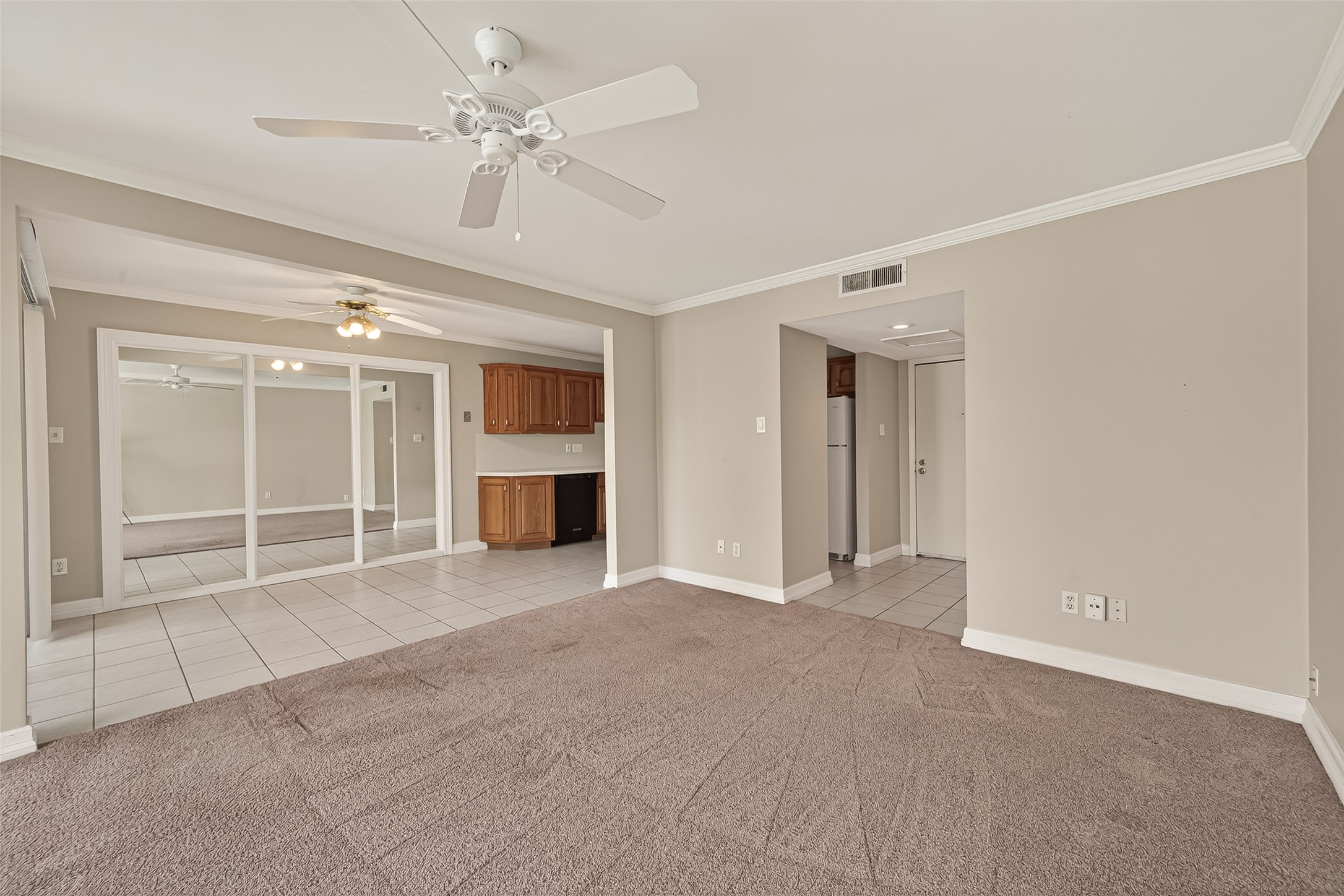 8211 Katy Freeway, Unit 19 Houston, TX 77024 - Photo 9 of 39 a view of an empty room with a fireplace