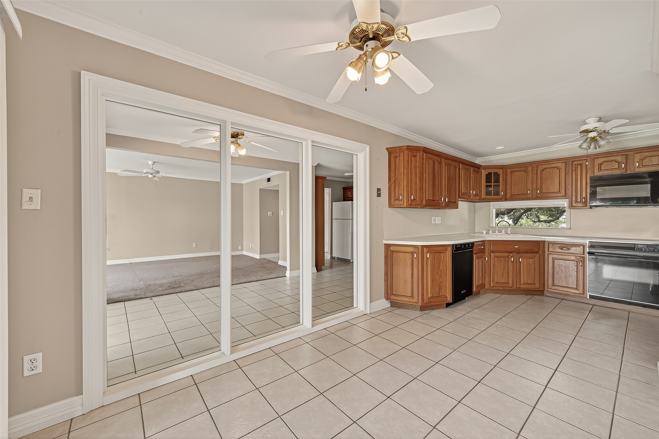 8211 Katy Freeway, Unit 19 Houston, TX 77024 - Photo 10 of 39 a kitchen with stainless steel appliances a sink and cabinets
