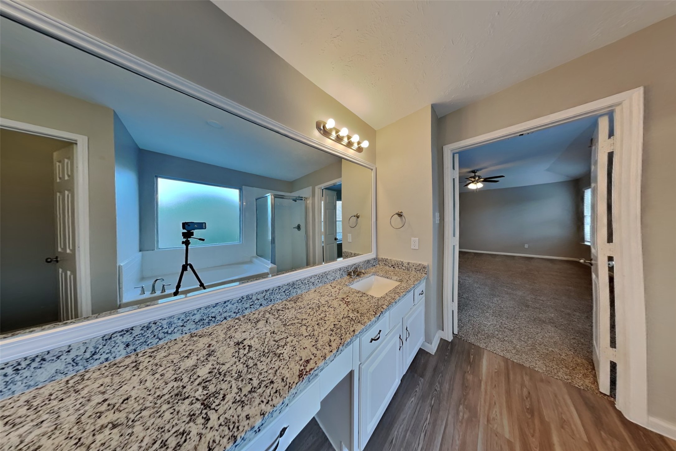 14706 Trailbrook Drive Houston, TX 77095 - Photo 19 of 23 a bathroom with a granite countertop sink and a mirror