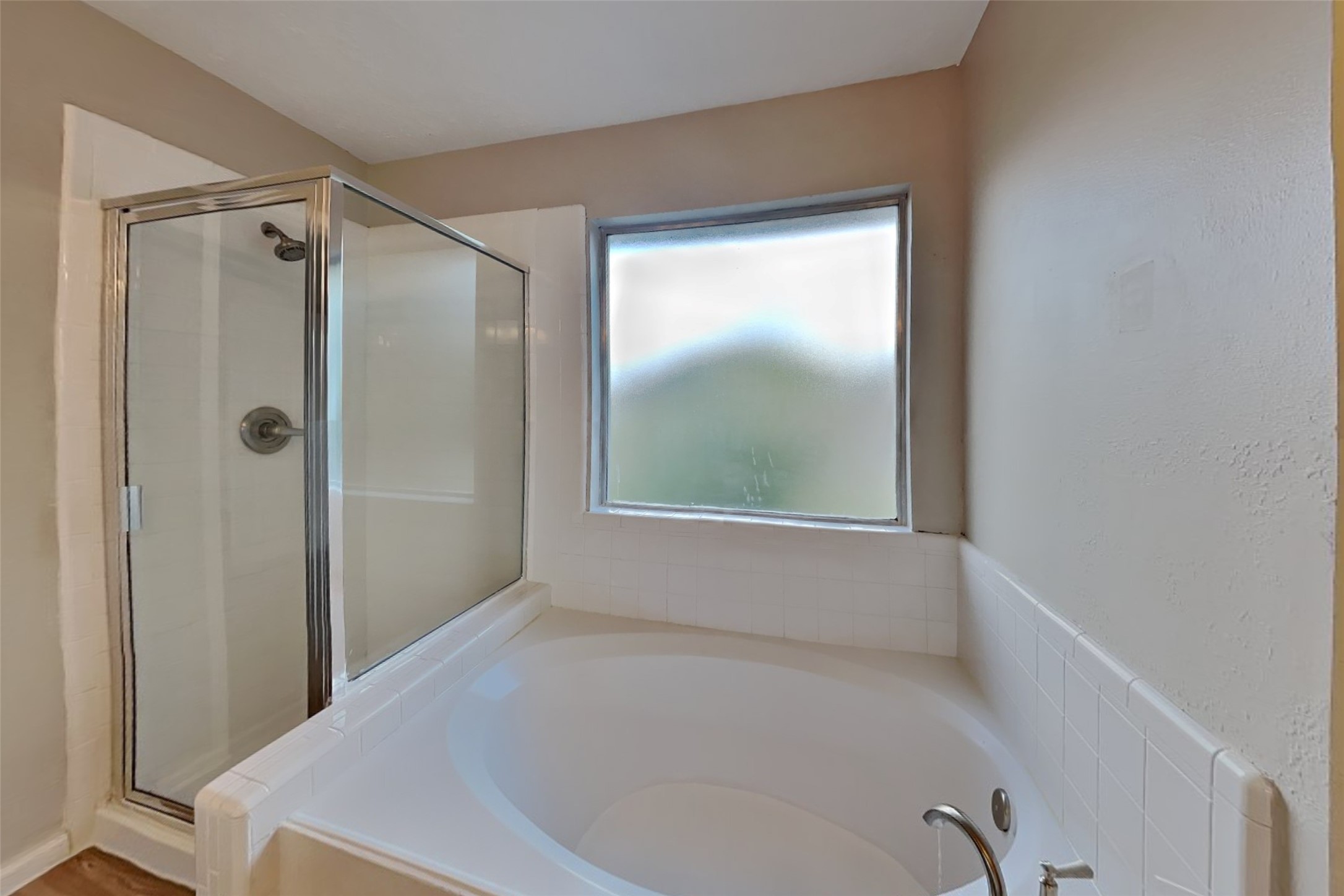 14706 Trailbrook Drive Houston, TX 77095 - Photo 8 of 23 a bathroom with a bathtub and shower