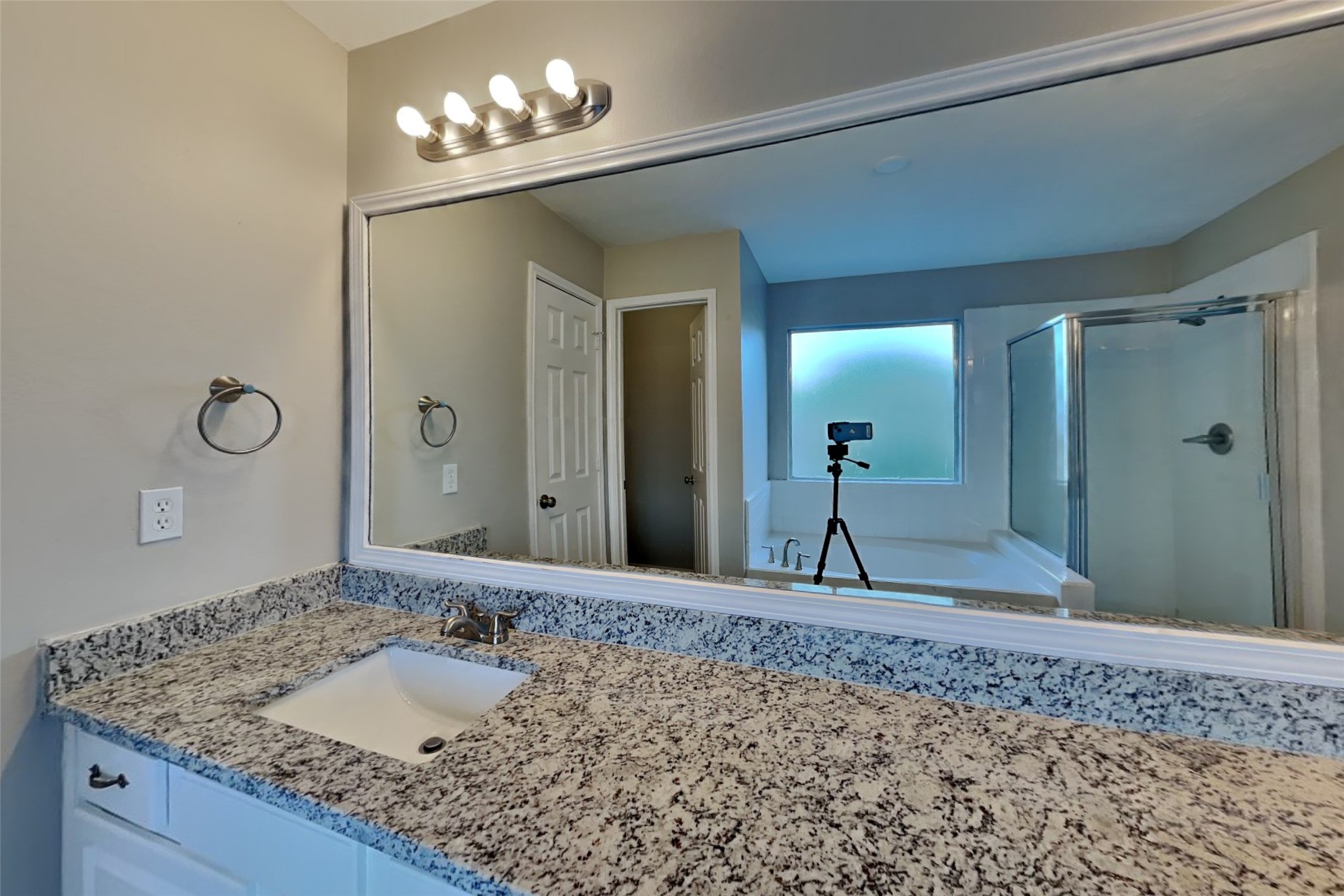 14706 Trailbrook Drive Houston, TX 77095 - Photo 9 of 23 a bathroom with a granite countertop sink and a mirror