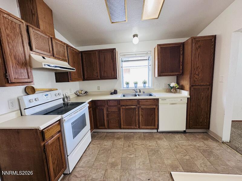 1182 Blue Lakes Road Reno, NV 89523 - Photo 7 of 31 a utility room with cabinets washer and dryer