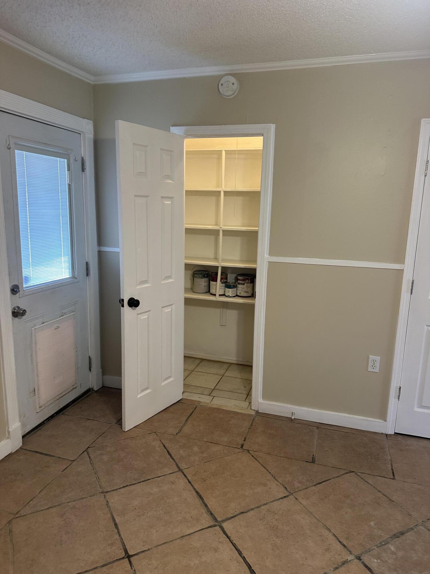 1510 28th Street Lubbock, TX 79411 - Photo 22 of 46 a view of a room with a furniture and a window