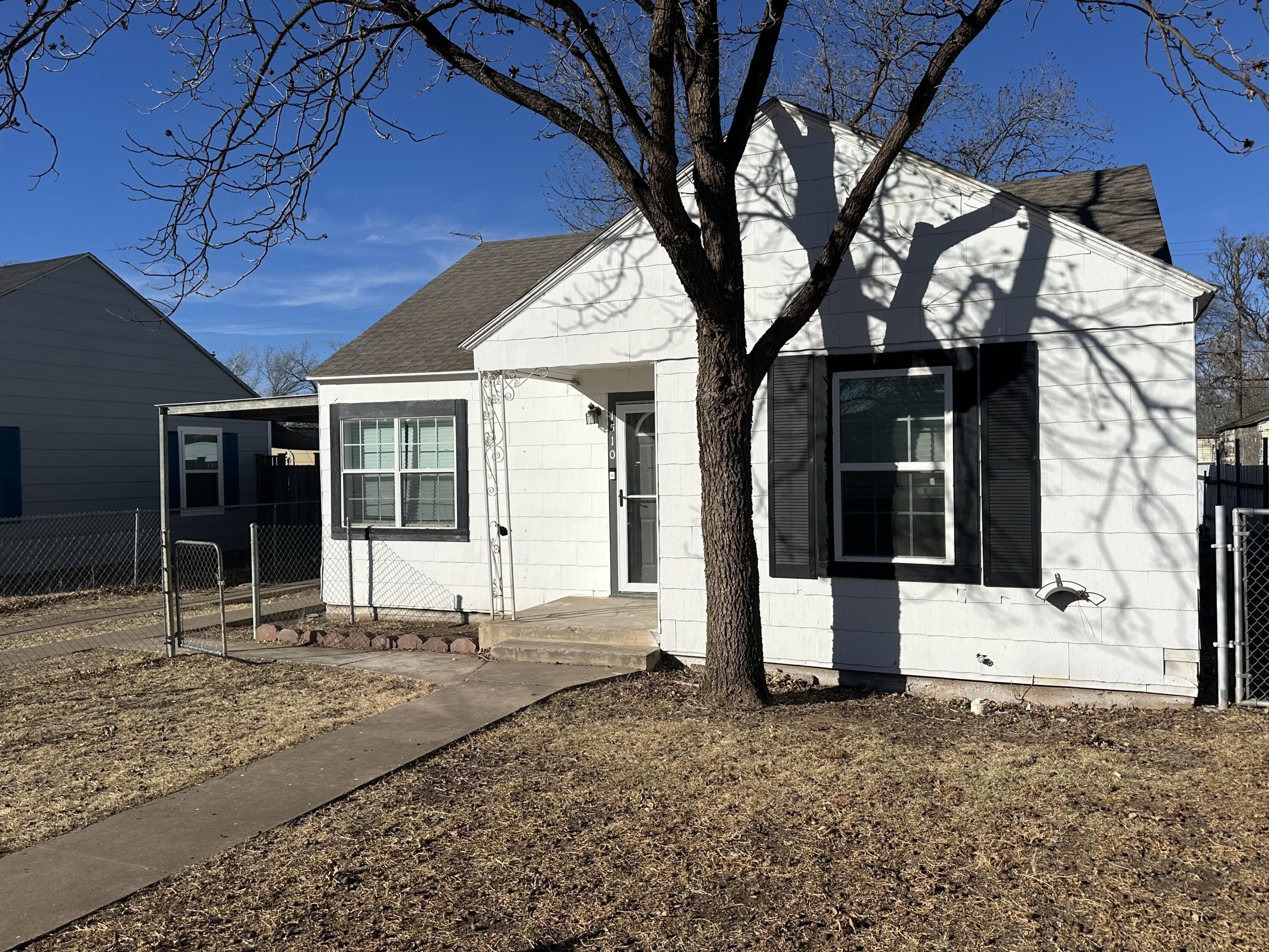 1510 28th Street Lubbock, TX 79411 - Photo 42 of 46 a house with trees in front of it