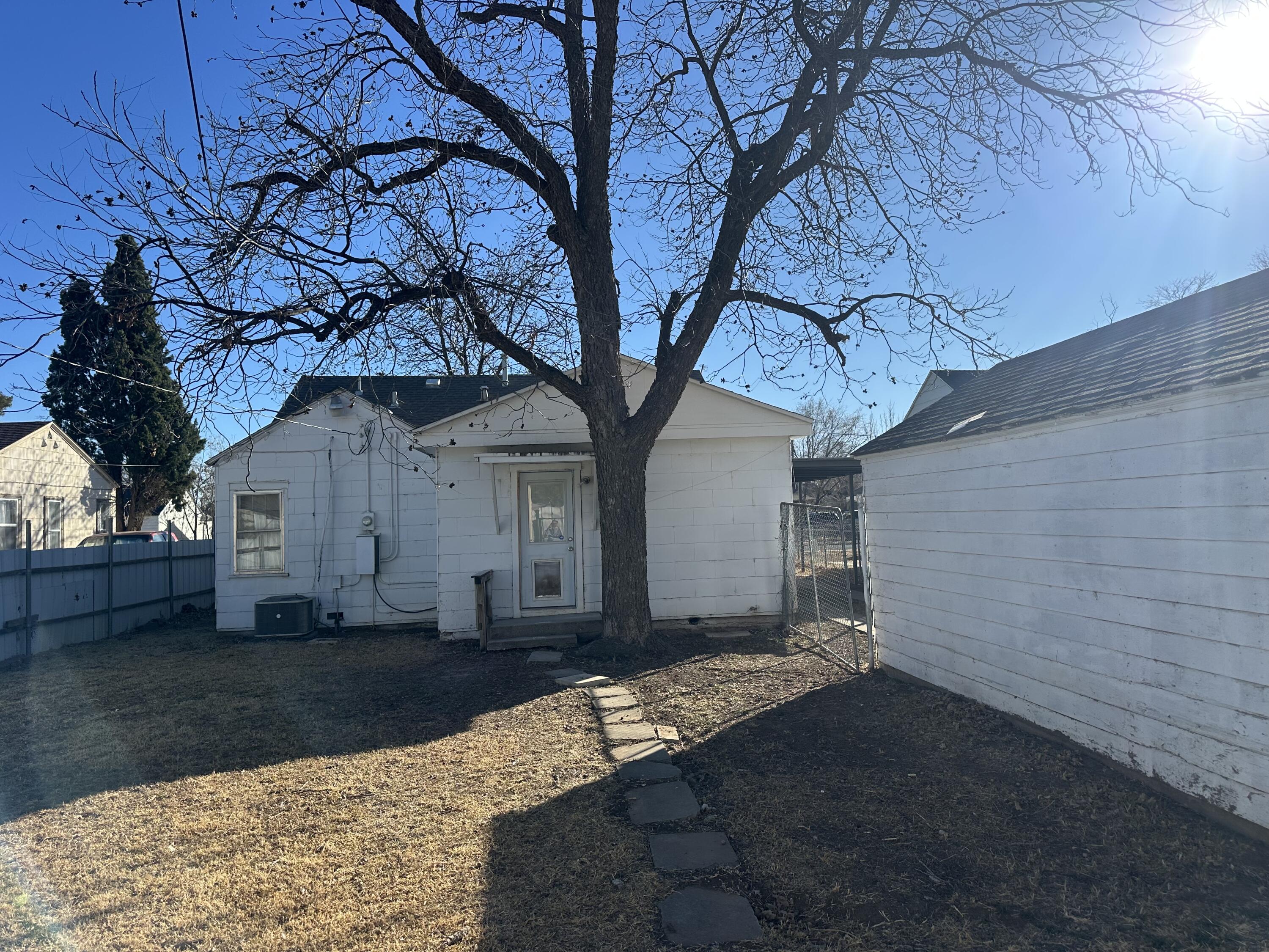 1510 28th Street Lubbock, TX 79411 - Photo 44 of 46 a tree in front of a white house