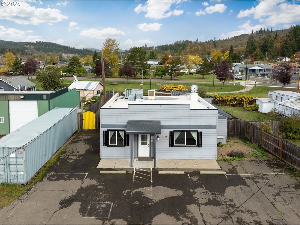 155 East Main Street Lowell, OR 97452 - Photo 1 of 17 a aerial view of a house with a ocean view