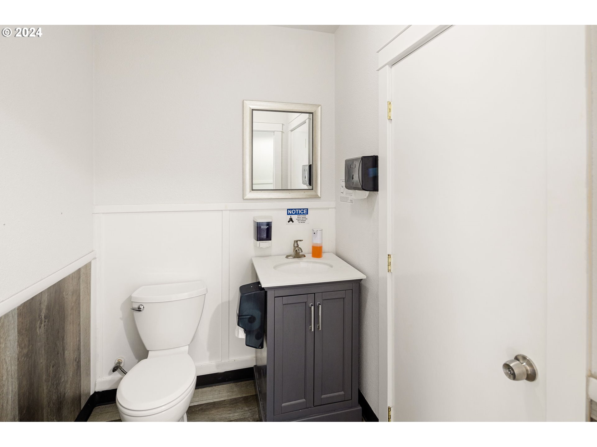 155 East Main Street Lowell, OR 97452 - Photo 13 of 17 a bathroom with a sink a toilet and mirror